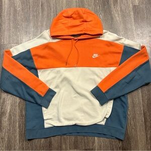 Nike orange, tan, and dark navy/teal hoodie. Size XL.